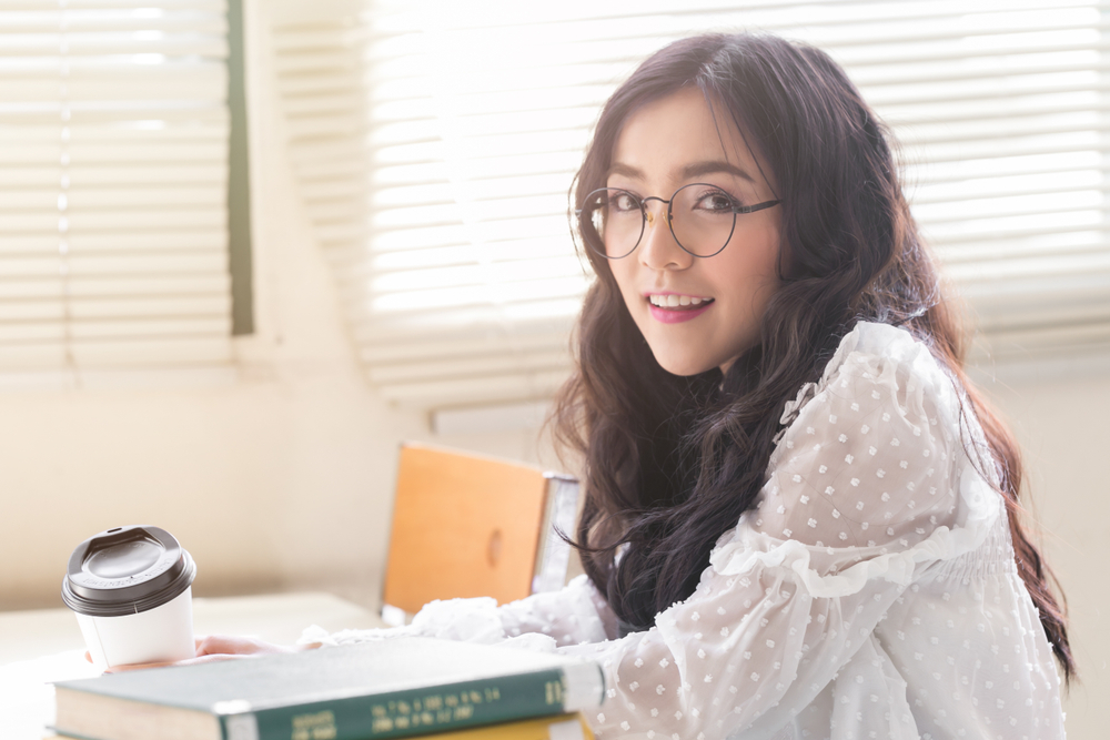 Young,Happy,Beauty,Asain,Woman,In,Libraly,University.